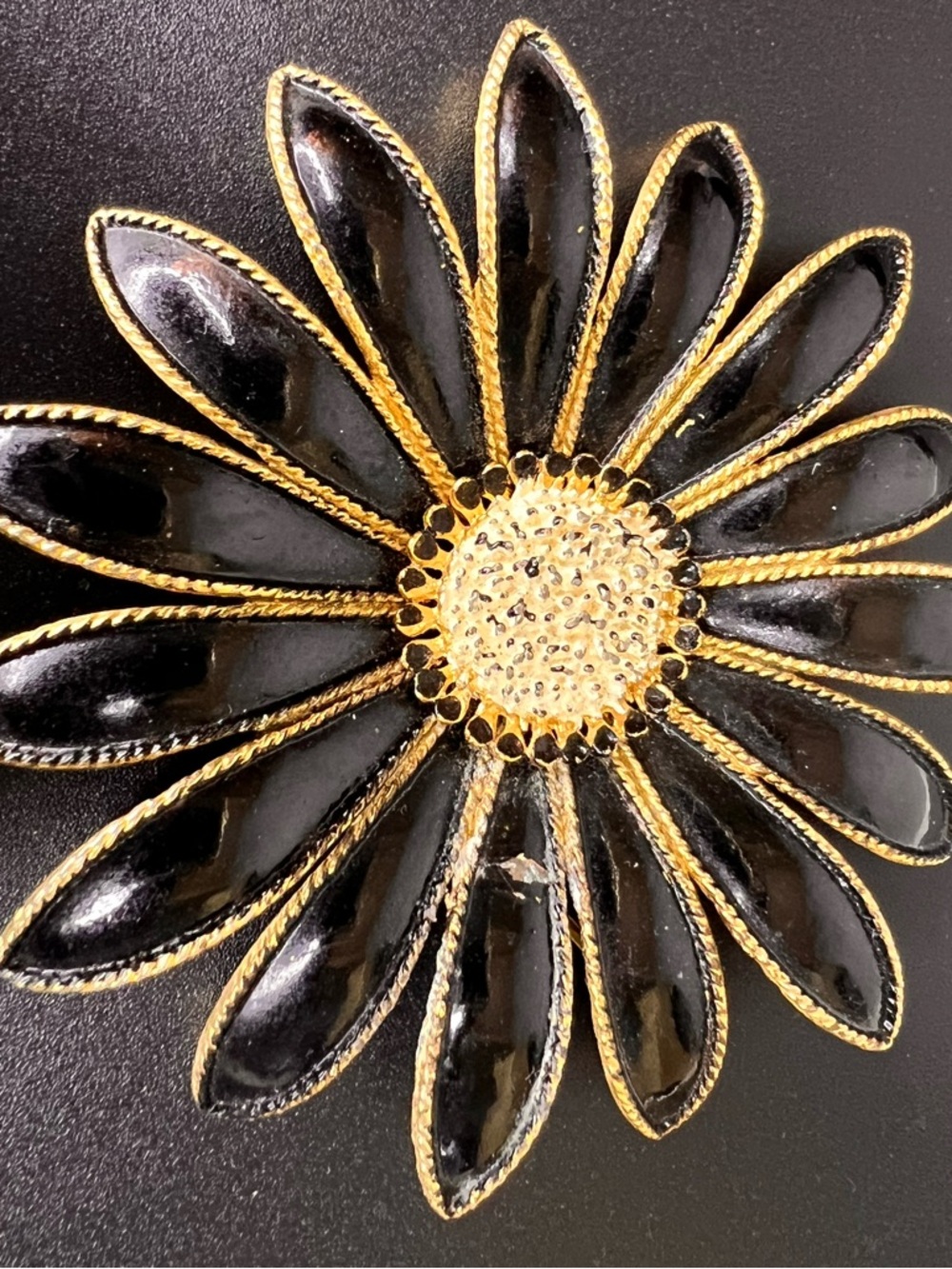Vintage Daisy Brooch Black Enamel Petals Gold Tone Setting Textured Center